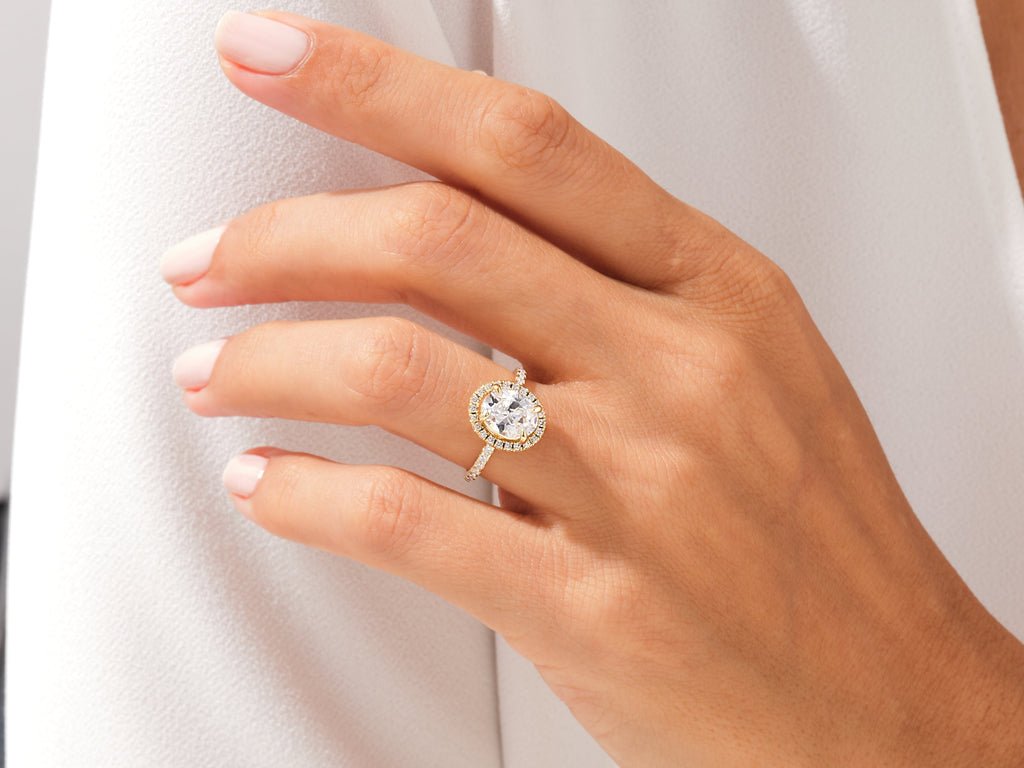 Unboxing view of oval cut pave diamond engagement ring