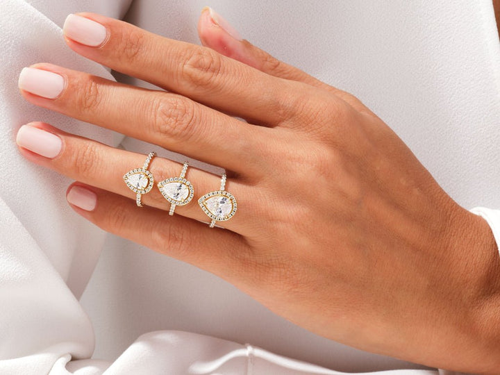 Pear cut pave engagement ring with IGI certified center diamond
