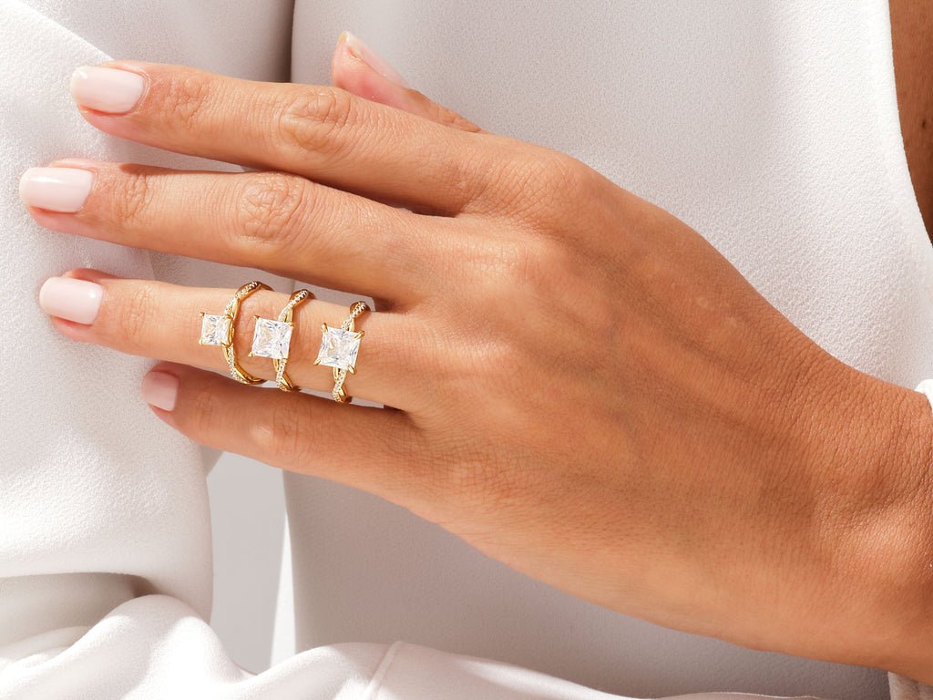 Angled view of princess cut diamond in pave setting