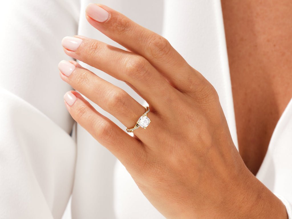 Side angle of cushion solitaire diamond engagement ring
