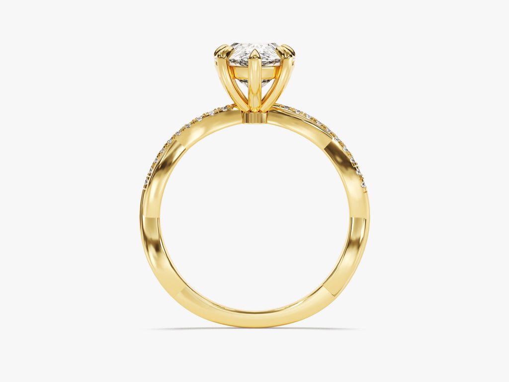 Profile view of pear cut pave engagement ring band