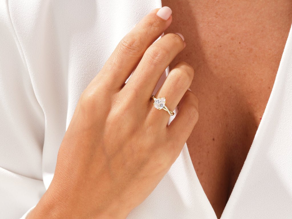 Pear cut diamond ring worn on hand
