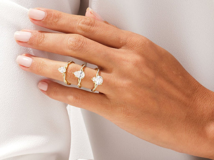 Side angle of pear pave diamond engagement ring