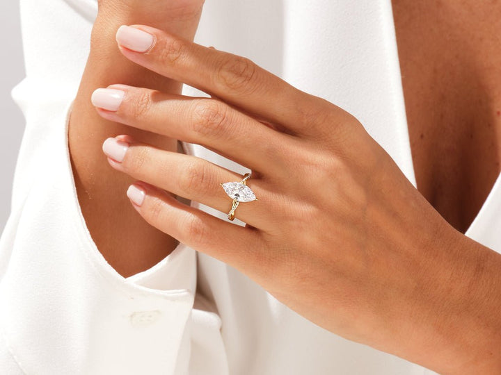 Lifestyle shot of marquise pave diamond ring on hand