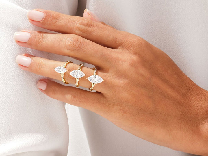 Marquise pave engagement ring shown on hand for true-to-life sizing