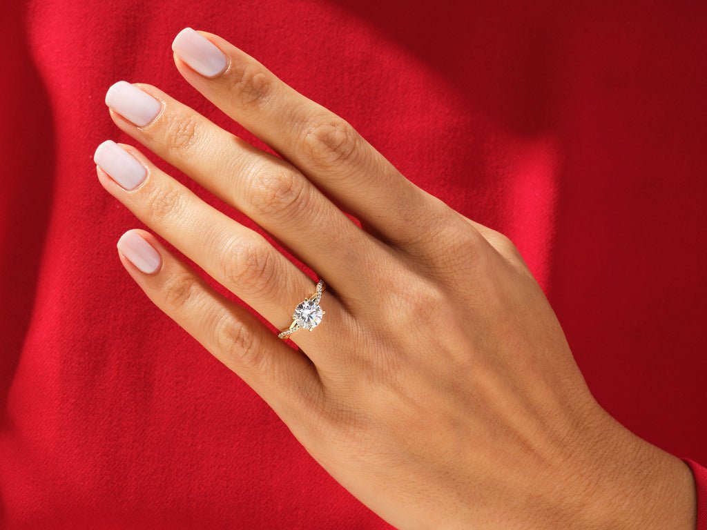 Round solitaire lab grown diamond ring fitted on finger