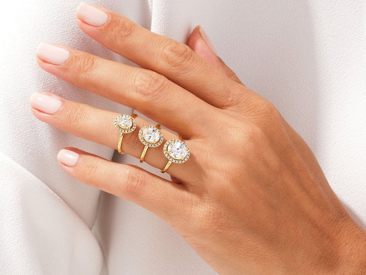 Oval halo engagement ring close-up showing high clarity diamond clarity