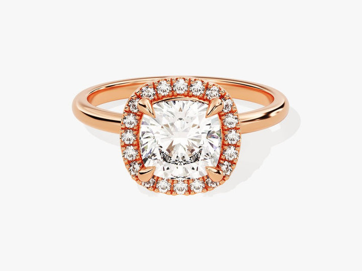 Cushion cut halo engagement ring shown in real-life wear