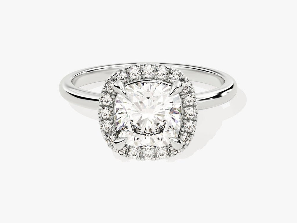 Cushion halo lab grown diamond ring fitted on finger