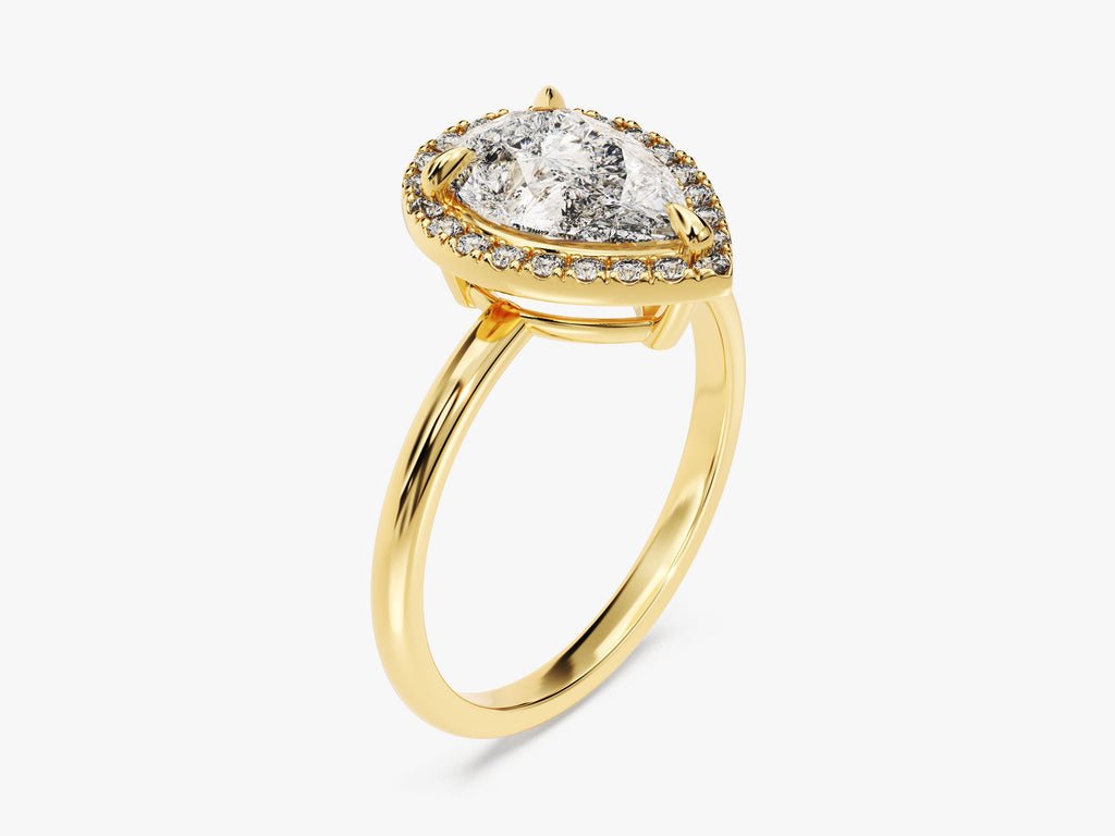 Angled view of pear cut diamond in halo setting