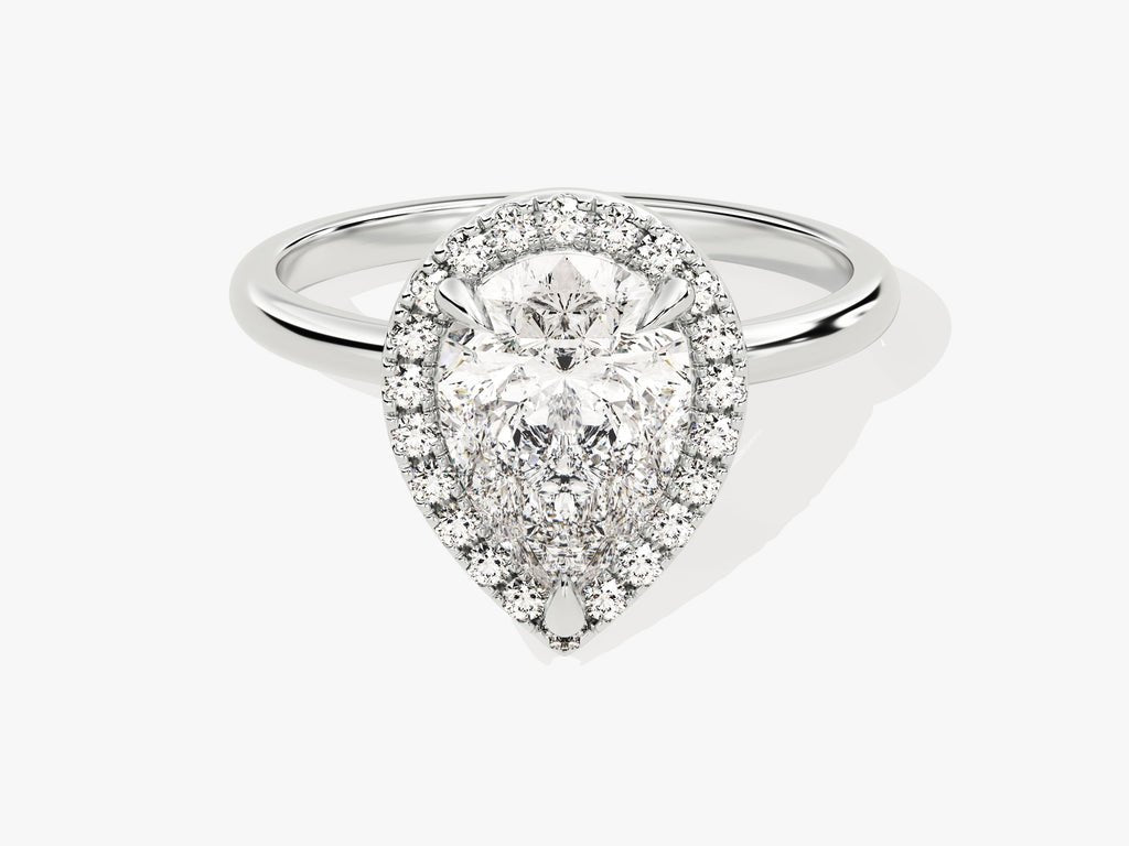 Pear halo engagement ring photographed in natural light