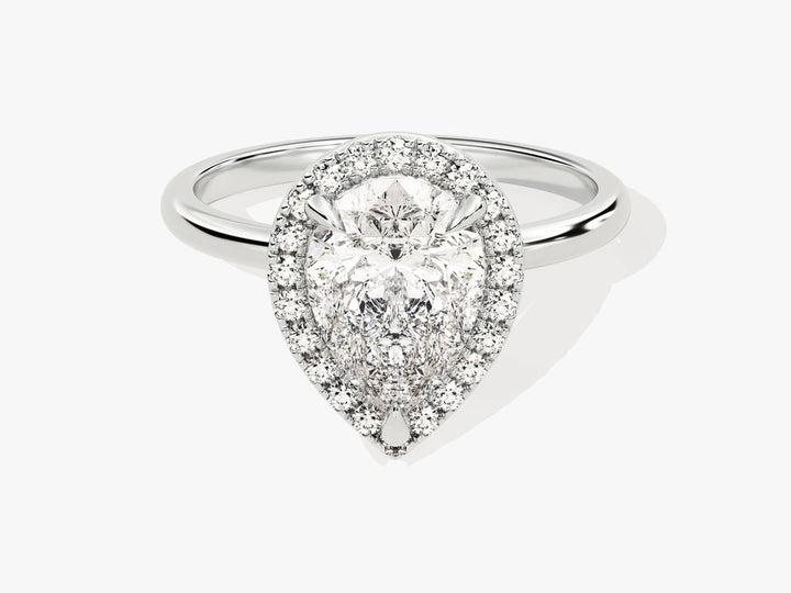 Pear halo engagement ring photographed in natural light