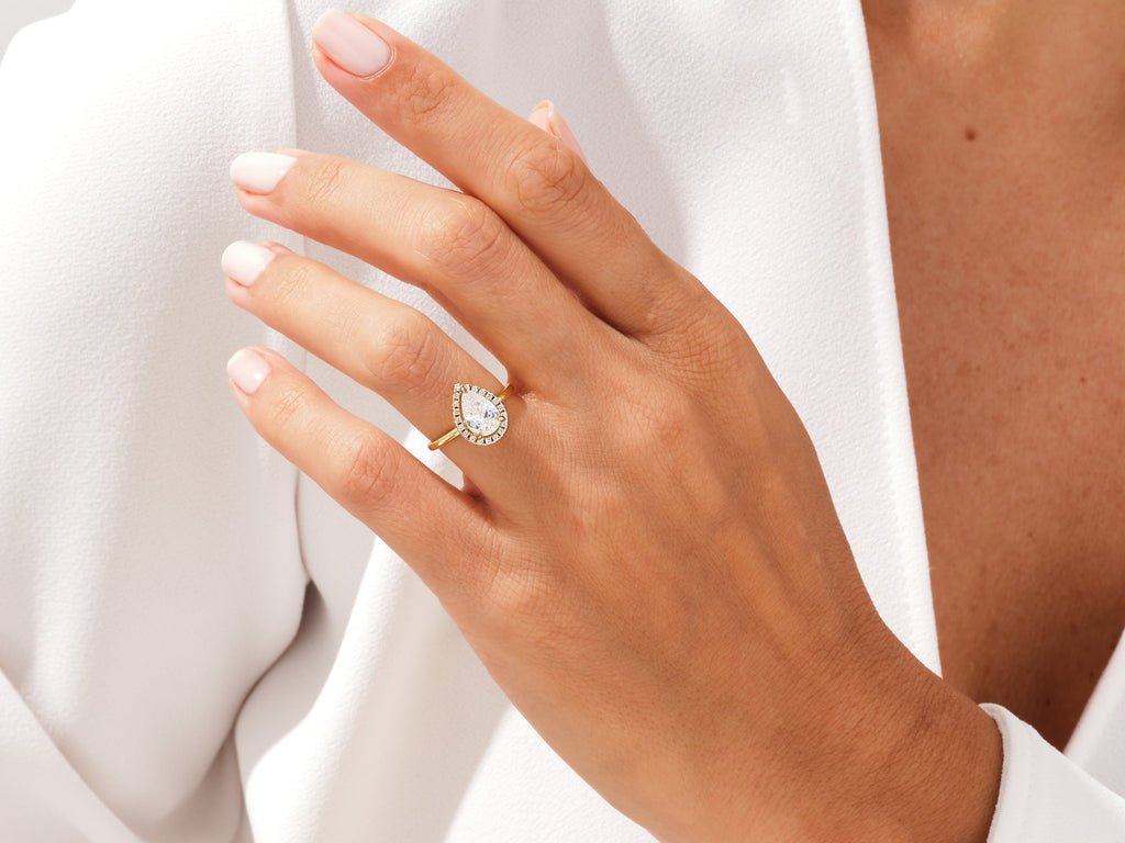 Pear halo engagement ring close-up showing high clarity diamond clarity