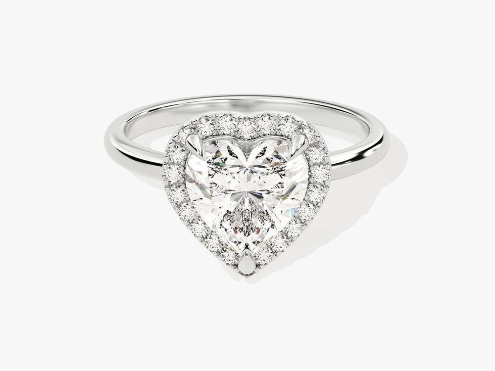 Lifestyle shot of heart halo diamond ring on hand