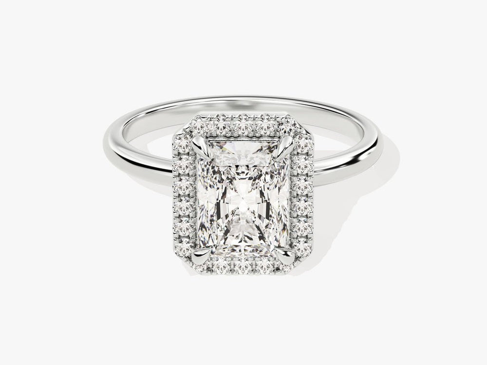 Radiant halo engagement ring shown on hand for true-to-life sizing