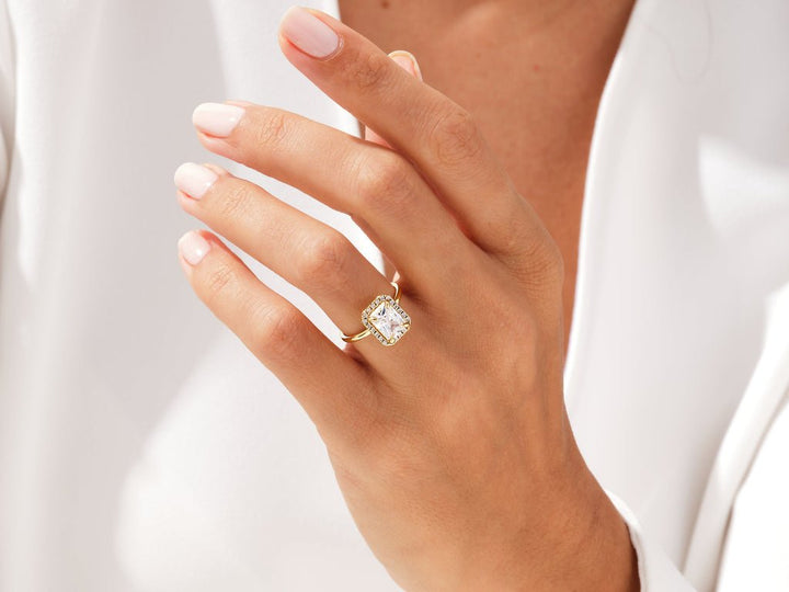 IGI certified radiant cut diamond in halo engagement ring setting