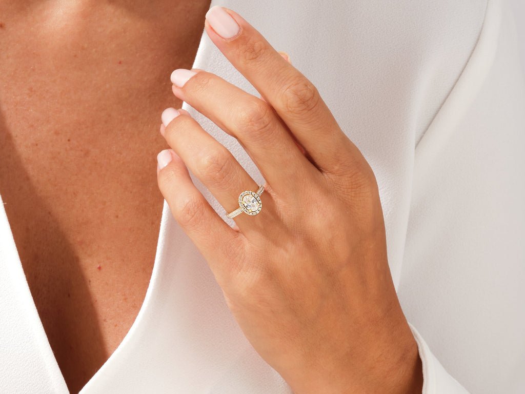 Oval pave ring set with an IGI graded diamond
