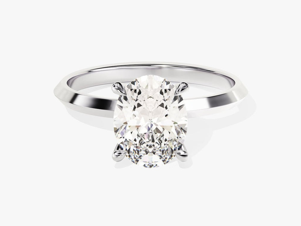 Detailed close-up of oval solitaire diamond engagement ring