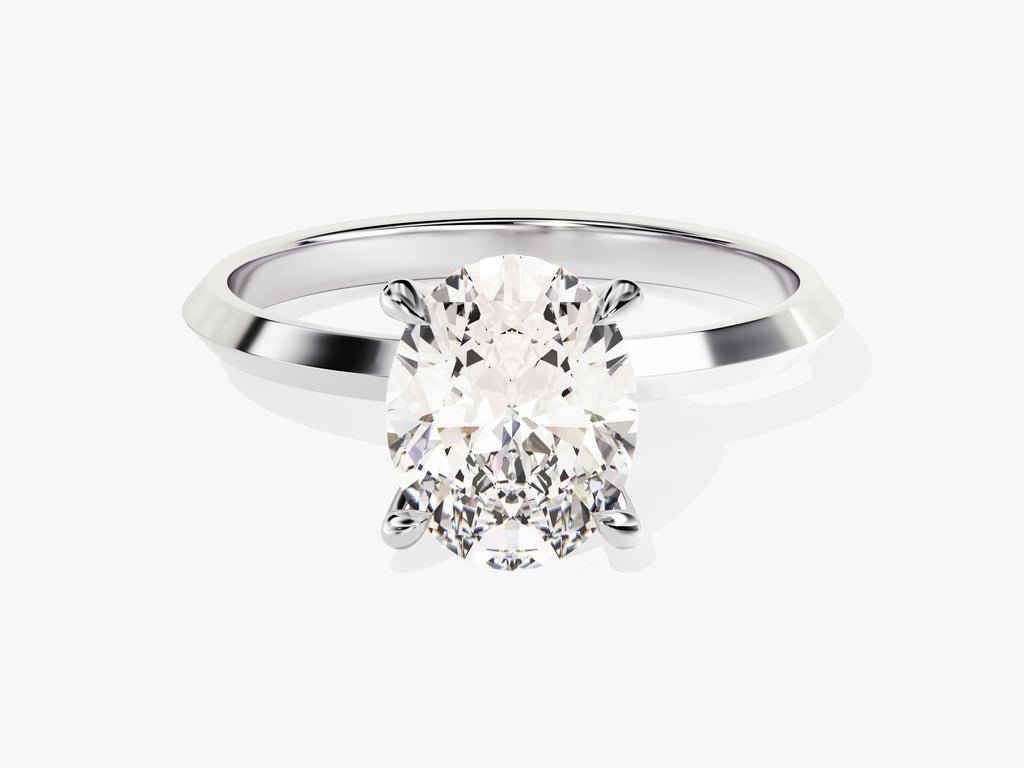 Detailed close-up of oval solitaire diamond engagement ring