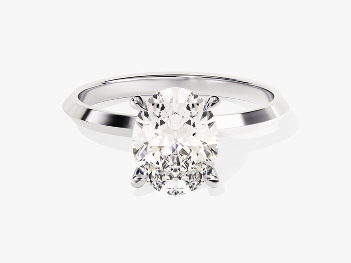Detailed close-up of oval solitaire diamond engagement ring