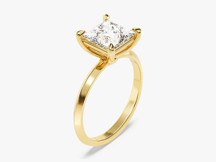 Princess solitaire engagement ring finished in polished solid gold