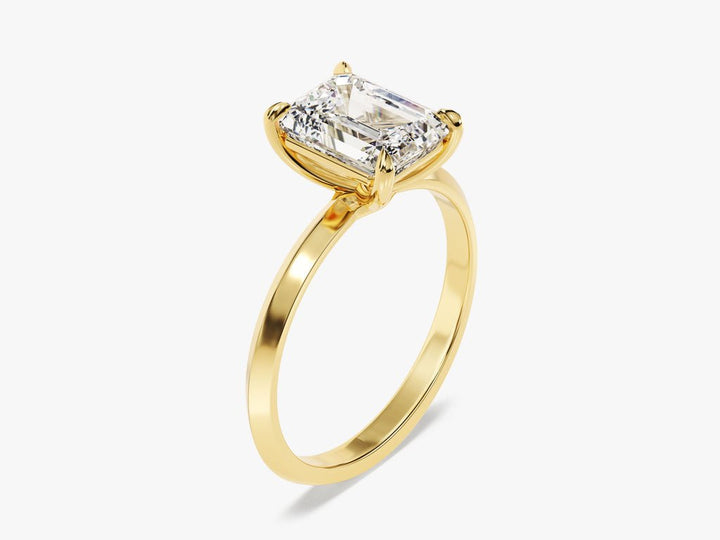 Emerald cut solitaire engagement ring shown in real-life wear