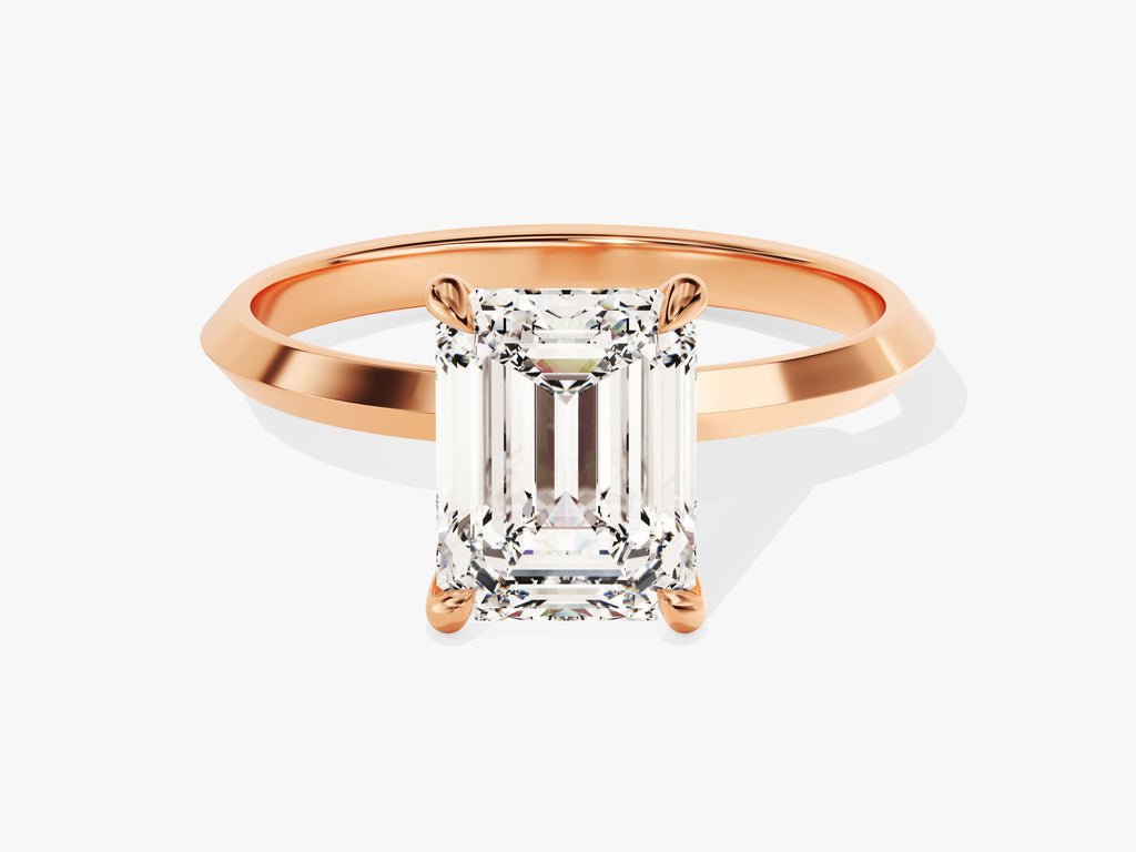 Emerald solitaire engagement ring shown on hand for true-to-life sizing