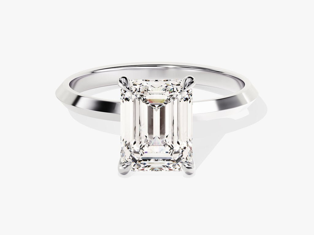 Emerald solitaire engagement ring viewed from the side