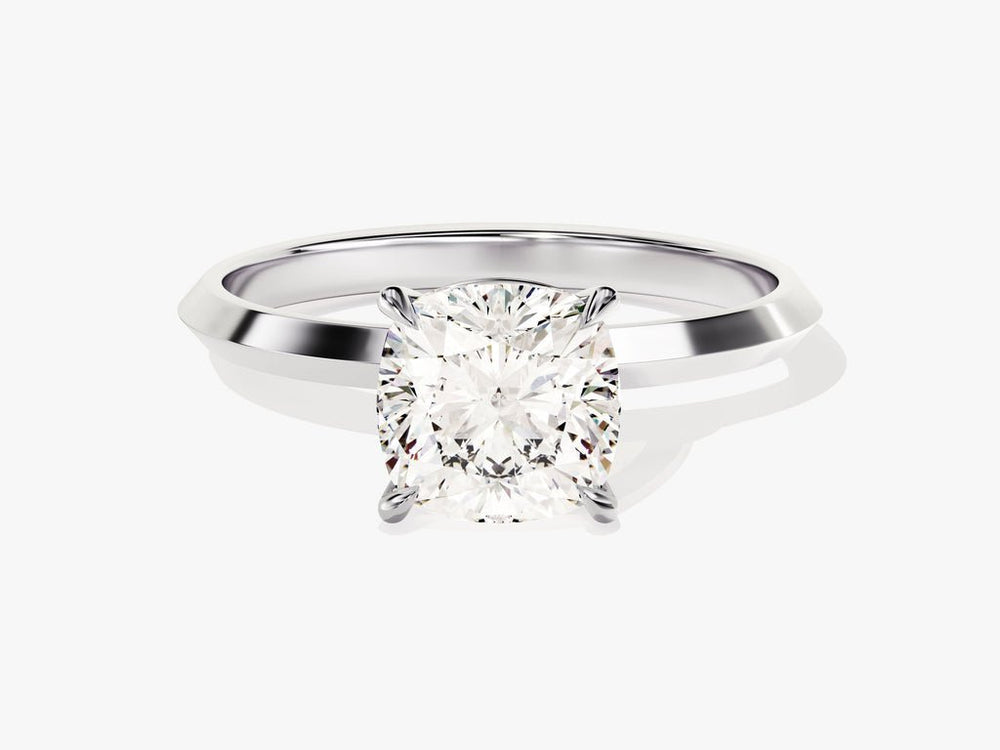 Cushion solitaire engagement ring close-up showing high clarity diamond clarity