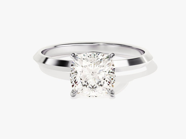Cushion solitaire engagement ring close-up showing high clarity diamond clarity