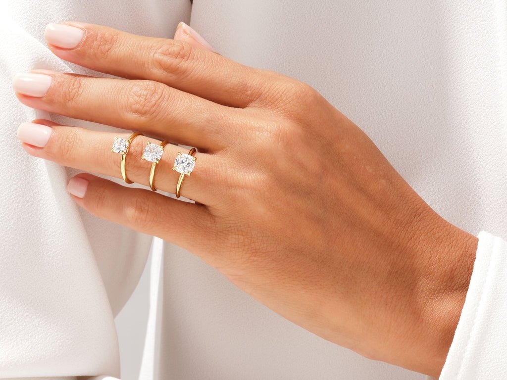 Close-up of cushion cut center diamond in solitaire engagement ring
