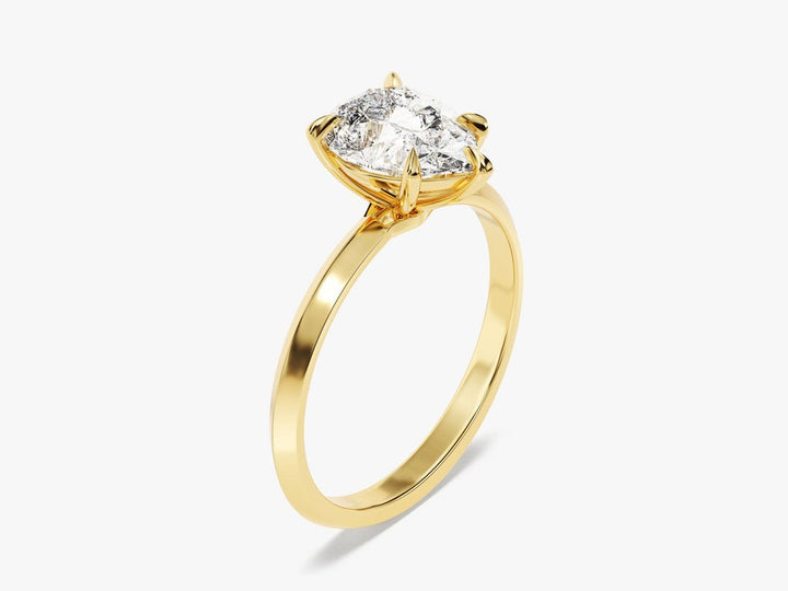 Pear solitaire diamond ring displayed on jewelry stand