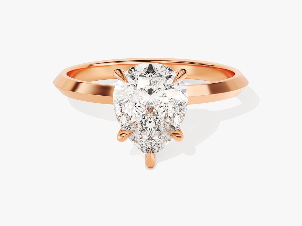 Pear solitaire engagement ring finished in polished solid gold
