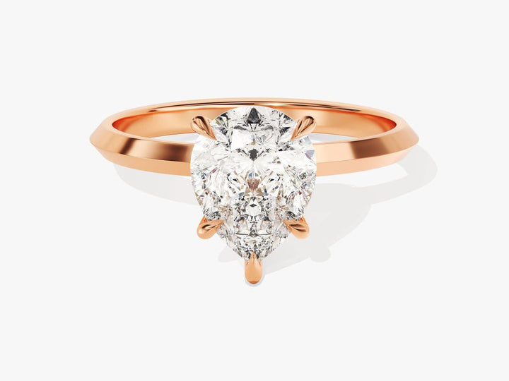 Pear solitaire engagement ring finished in polished solid gold