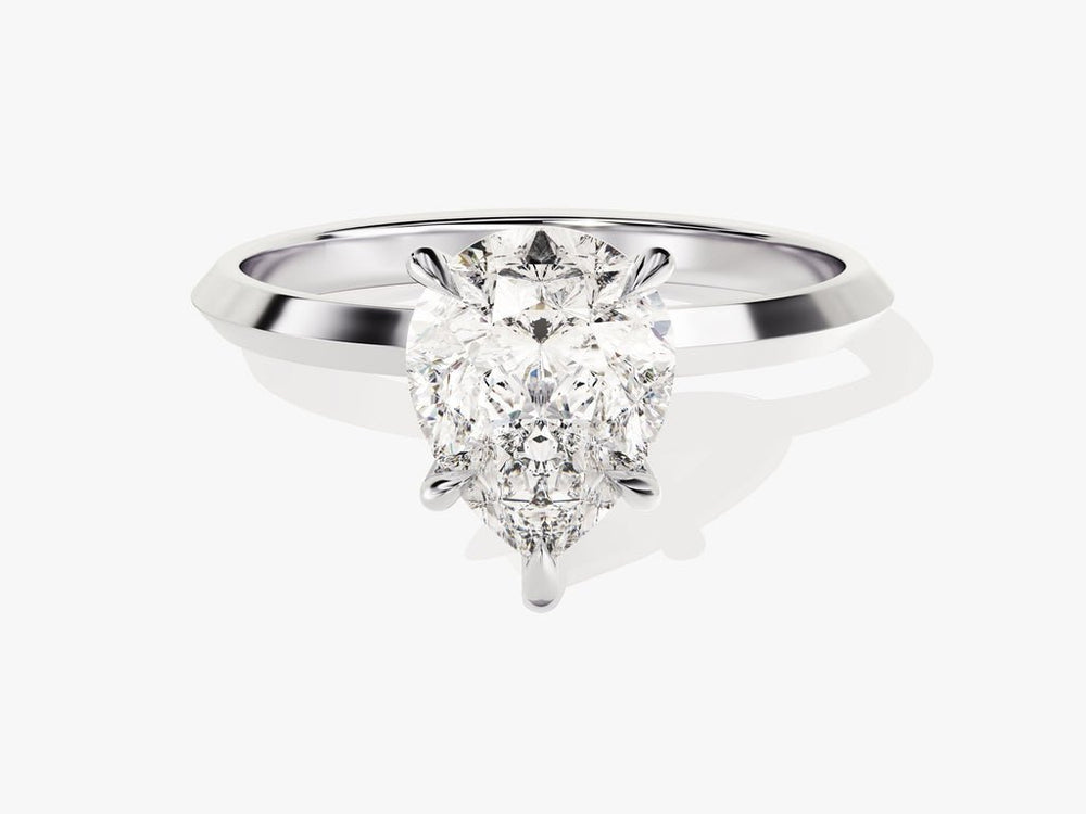 Fine craftsmanship detail on pear solitaire engagement ring