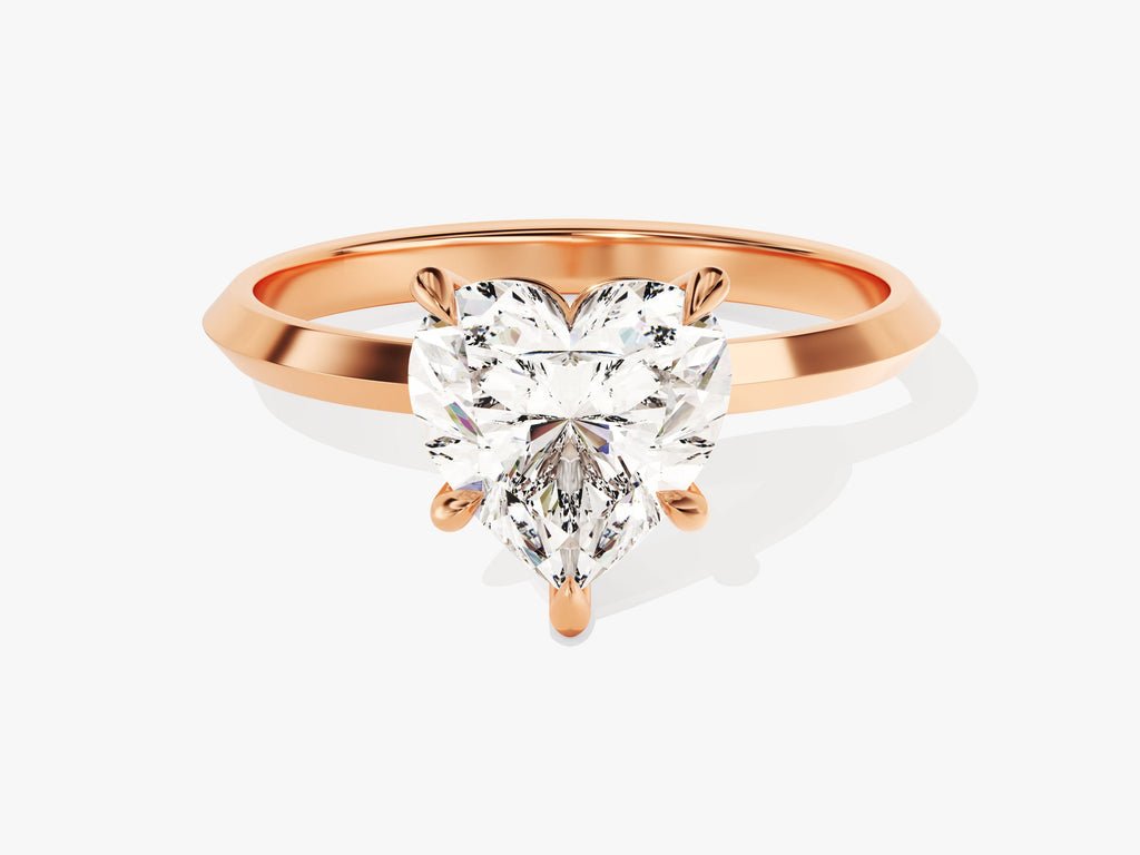 Heart cut solitaire engagement ring shown in real-life wear