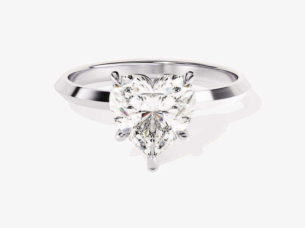 Heart solitaire lab grown diamond ring fitted on finger