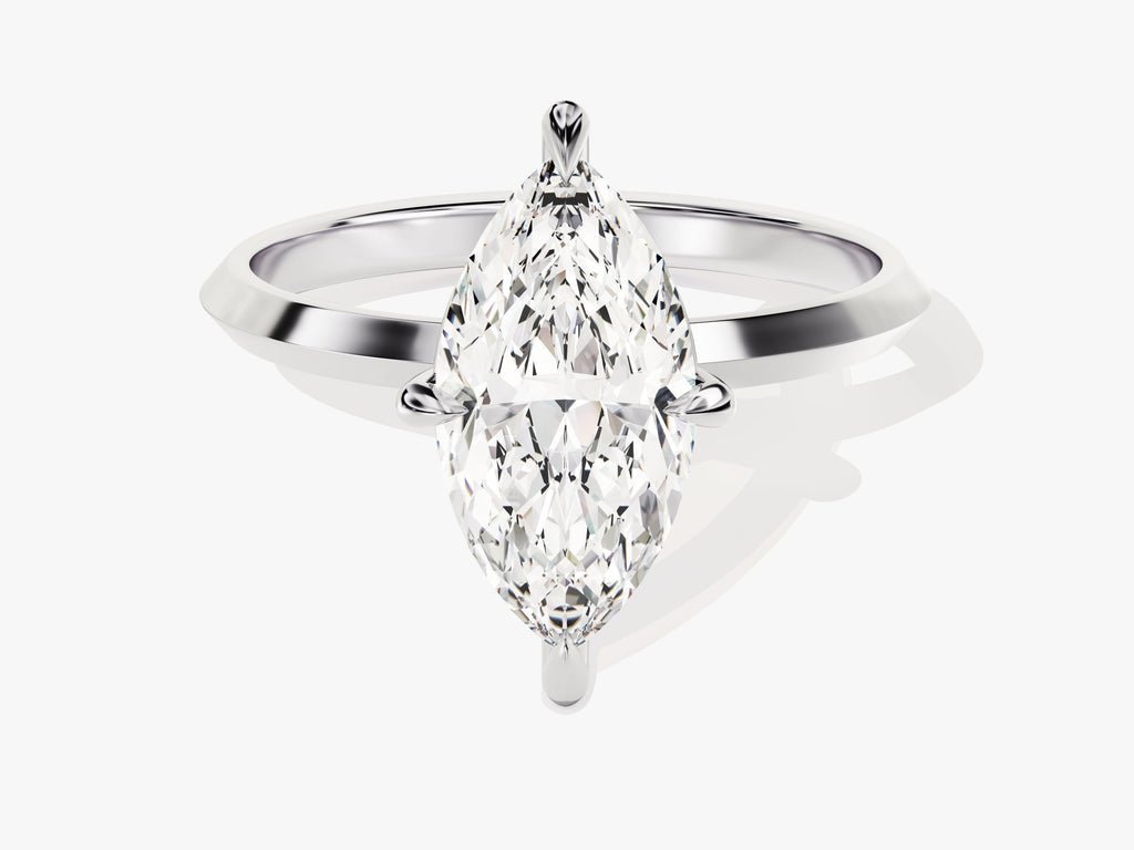 Marquise solitaire diamond ring displayed on jewelry stand