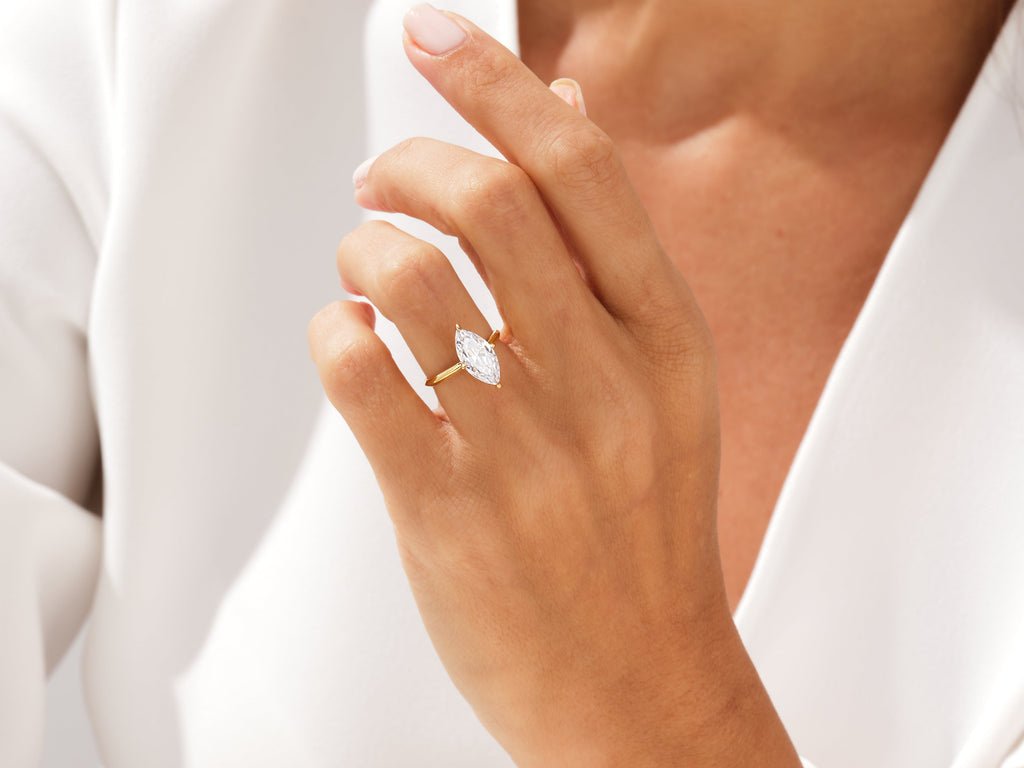 Close-up of marquise cut center diamond in solitaire engagement ring