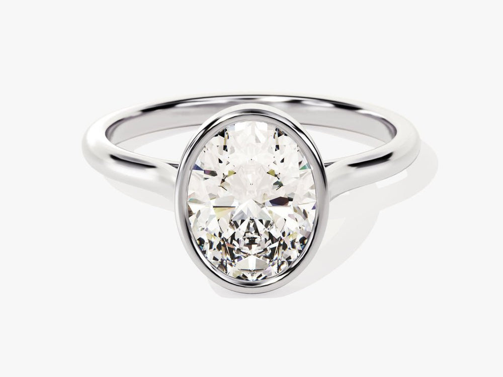 Oval cut engagement ring shown with authenticity certificate