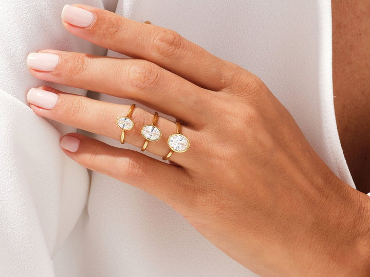Oval bezel engagement ring with IGI certificate and packaging