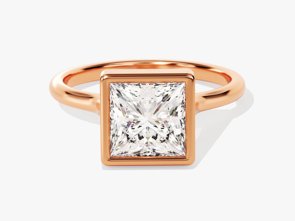 Close-up of princess cut center diamond in bezel engagement ring