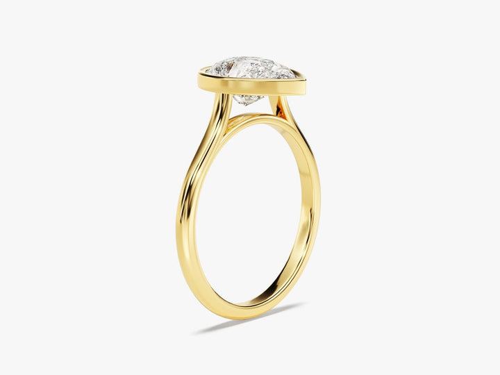 Pear bezel diamond engagement ring available in multiple metals