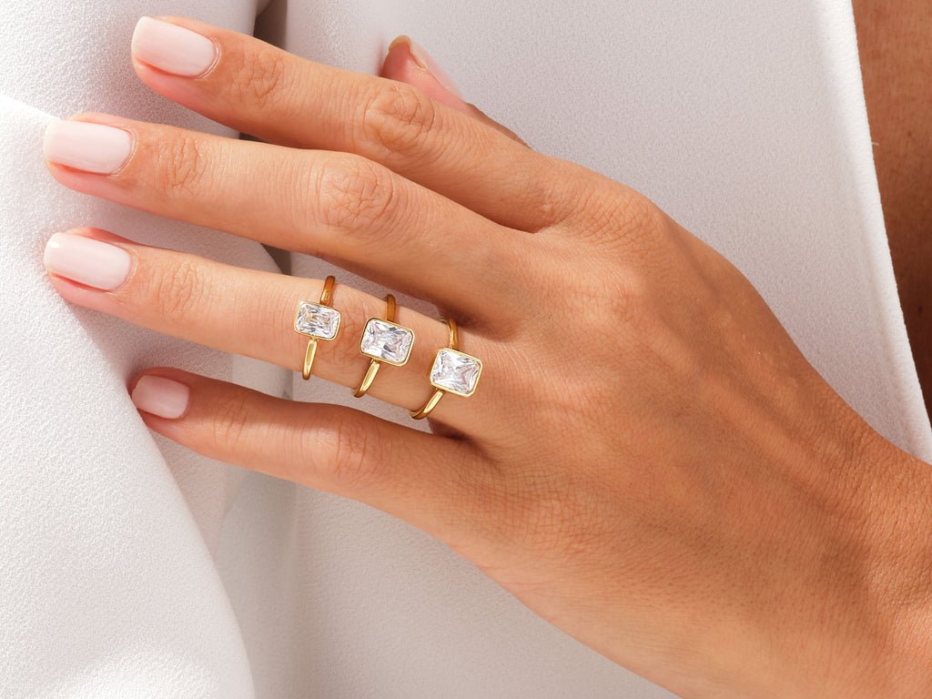 Certified radiant cut diamond featured in bezel engagement ring