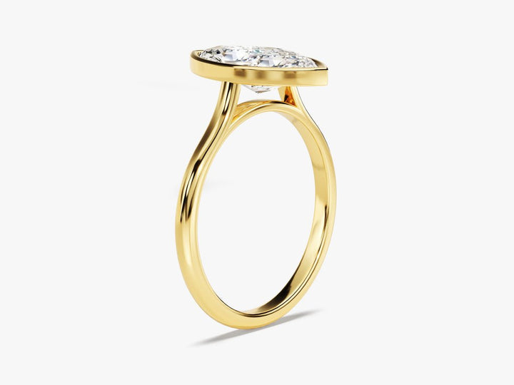 Certified marquise cut diamond featured in bezel engagement ring