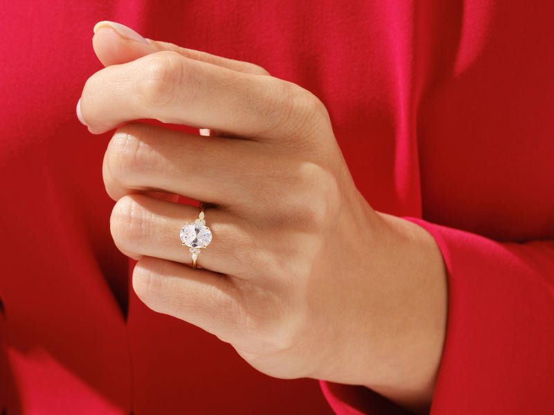 Oval three stone engagement ring viewed from the side