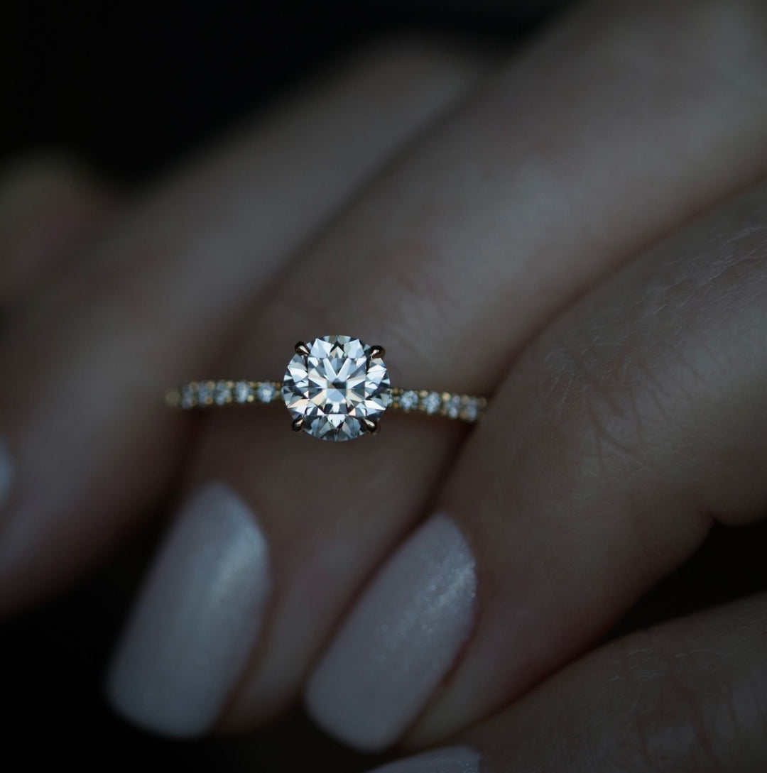 Profile view of round cut solitaire engagement ring band
