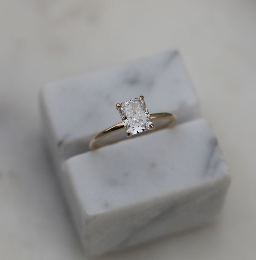 Unboxing view of radiant cut solitaire diamond engagement ring