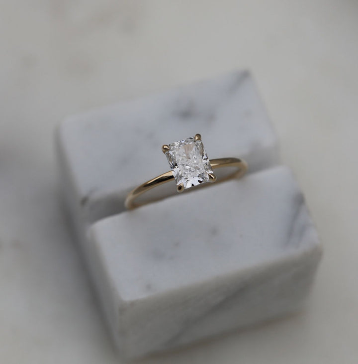 Unboxing view of radiant cut solitaire diamond engagement ring