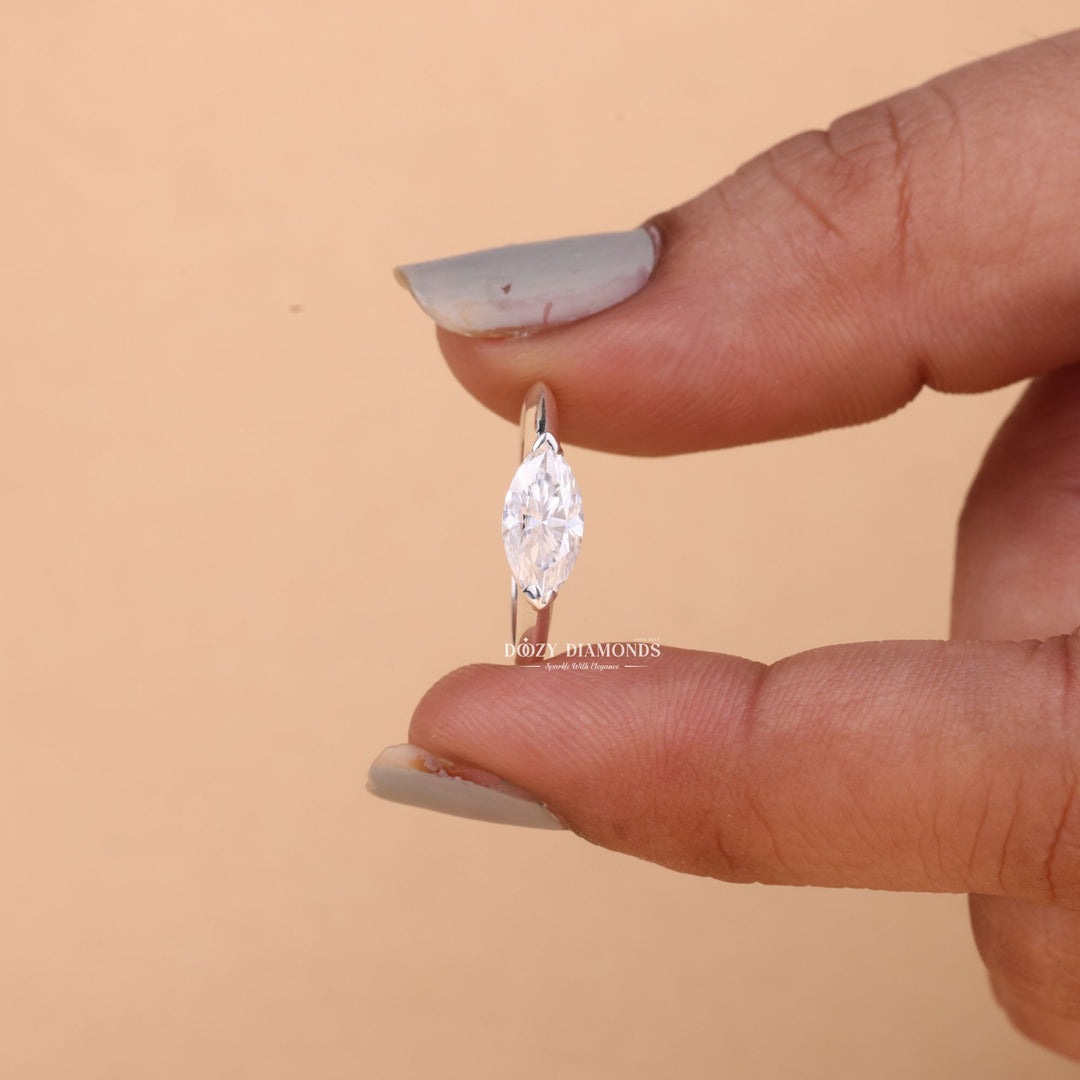 Detailed close-up of marquise east west diamond engagement ring